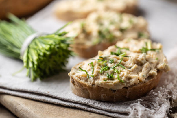 istock Bryndza spread with red pepper, garlic and chives. Bread with cheese spread. 2122069889