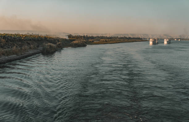 Nile river landscape with tourists tour boats