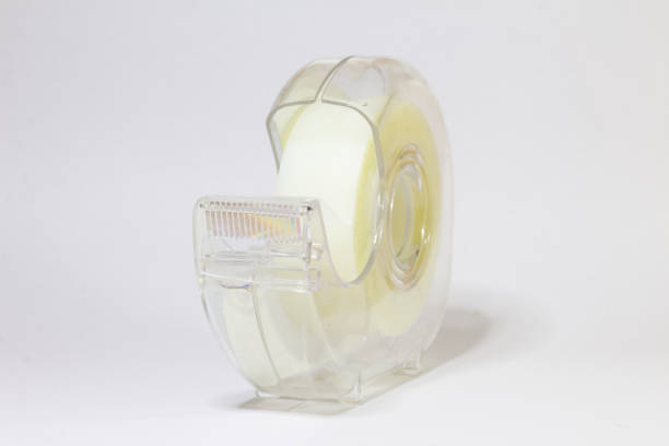A plastic case with a roll of tape on a white background