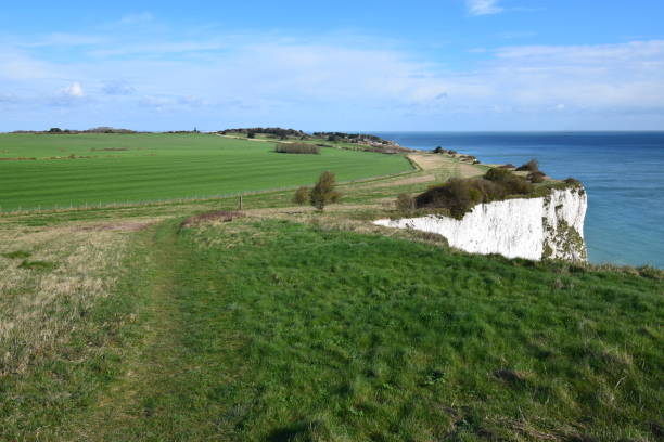 istock Lush green meadows ending in the white cliffs of Dover, Kent, UK 2122117382
