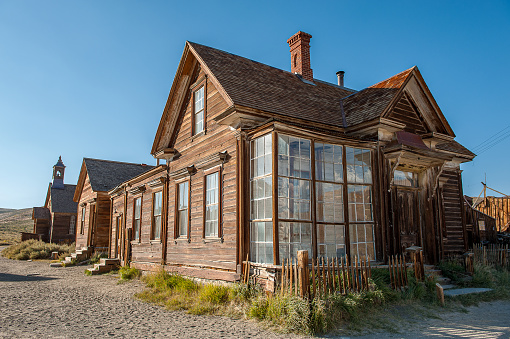 Abandoned mining building in the arid desert landscape of Bodie State Park Ghost Town California, USA