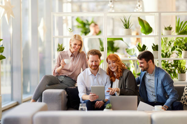 istock Happy entrepreneurs working on digital tablet at casual office. 2122145677