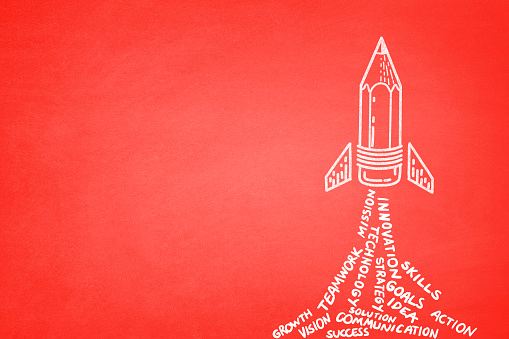Start up concept with space rocket with business related words on red background
