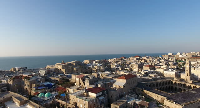 Panoramic Aerial View of Acco, Acre, Akko old city with crusader palace, city walls, arab market, knights hall, crusader tunnels, in Israel. Green Roof Al Jazzar Mosque