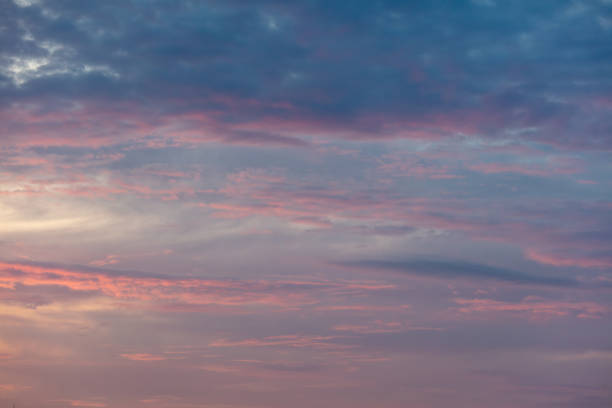 istock Pink blue clouds at sunset as background 2122186135