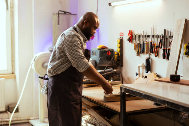 istock Woodworking professional doing quality assurance on timber piece 2122191879