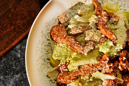 Caesar salad in a plate close-up