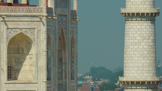 Taj Mahal in Agra, Uttar Pradesh, India. Close up of tower and walls details. air melts and shivers due to high temperature. Seven world wonders. Fabulous Taj mahal travel concept. indian islamic heritage at sunny day