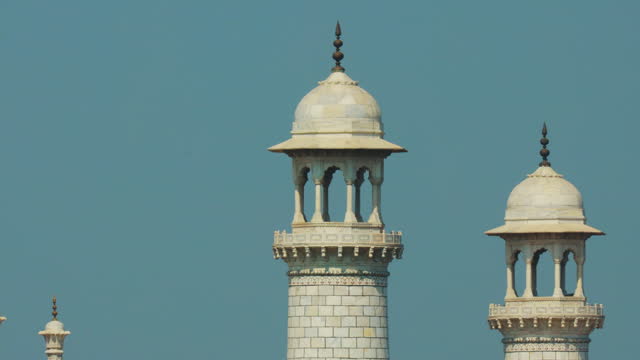 Taj Mahal in Agra, Uttar Pradesh, India. Close up of towers and walls details. air melts and shivers due to high temperature. Seven world wonders. Fabulous Taj mahal travel concept. indian islamic heritage at sunny day
