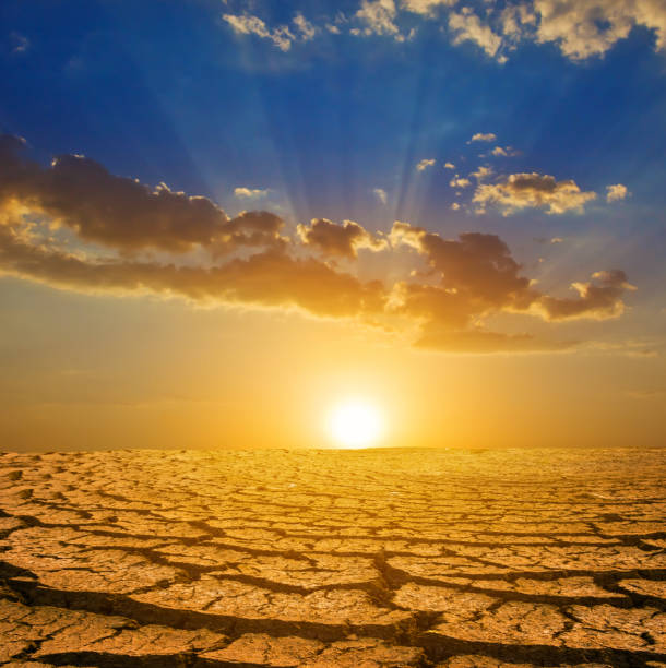 istock dry cracked earth at the dramatic sunset 2122273435