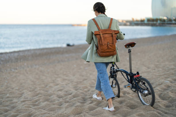 istock Woman with bicycle in city with copy space. 2122273442