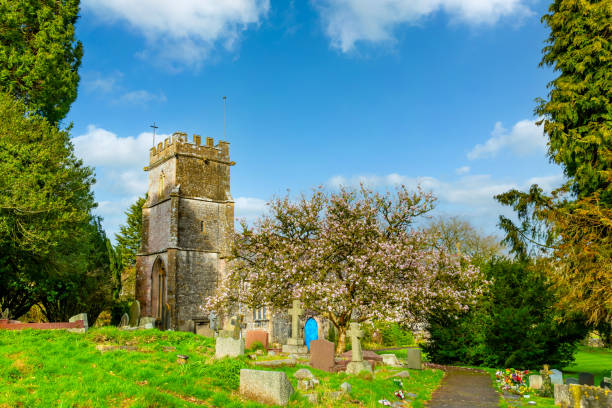 Sunset view of the yard cemetery of St Mary Church, in Painswick, the Cotswolds region, England, UK