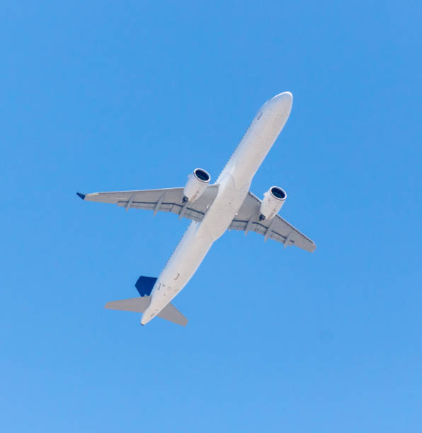 istock Airplane in flight against a blue sky 2122345654