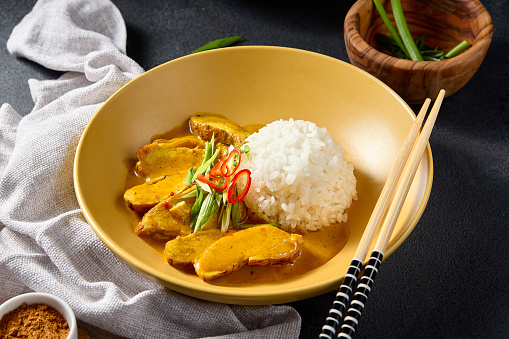 Close-up Chicken Curry with Rice on wood table