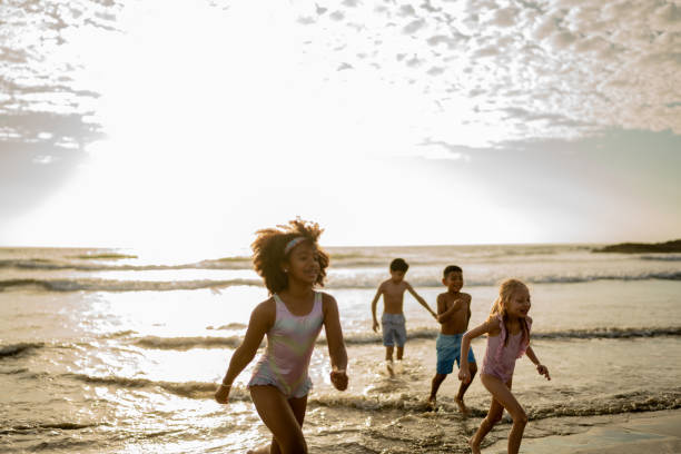 istock Friend children playing on the beach 2122371141