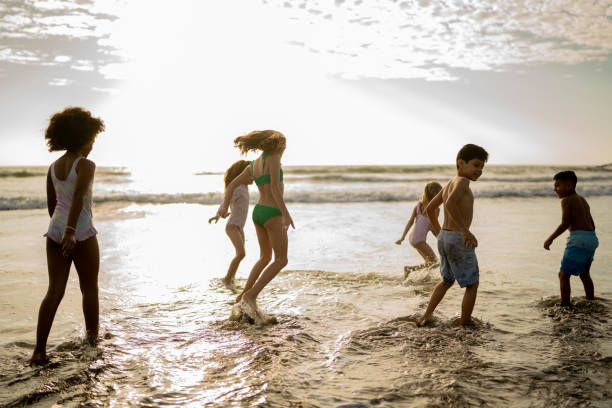 istock Friend children playing on the beach 2122371142