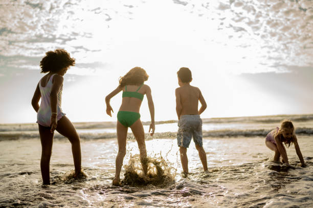 istock Friend children playing on the beach 2122371143