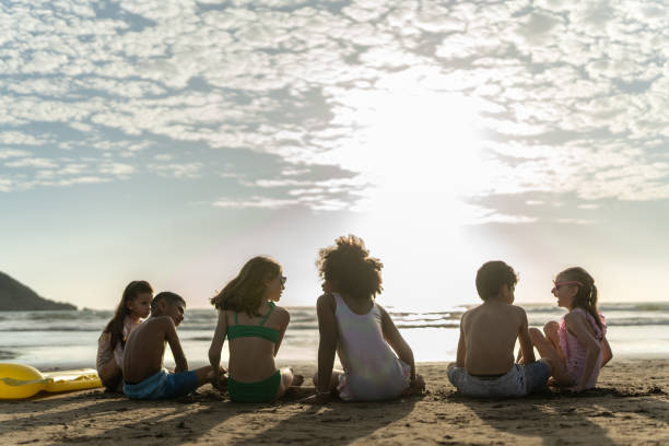 Friend children talking on the beach