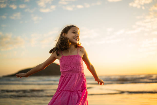 Child girl having fun on the beach