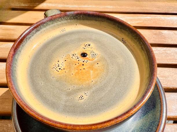 istock Hot Americano,black coffee placed on an old table, sunlight reflecting 2122401243