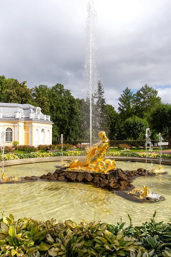 St. Petersburg, Russia - September 05, 2022: Grand Cascade and Grand Palace of the Palace and Park Ensemble in Peterhof, St. Petersburg, Russia