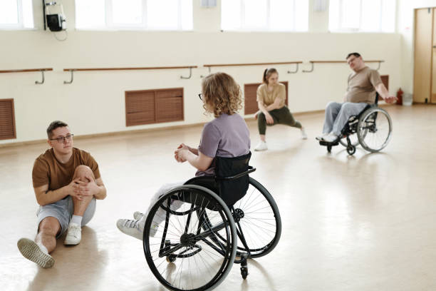 istock Group of Diverse Dancers Doing Stretching Exercises 2122412800