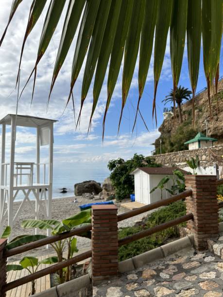 Lifeguard post on the beach Picture of a white lifeguard post on one of the small beaches of Nerja, Spain. def picture photos stock pictures, royalty-free photos & images