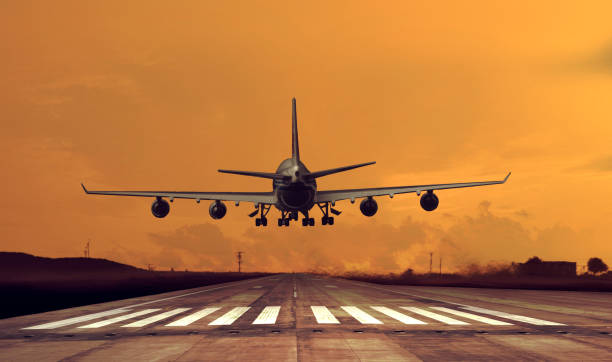 istock Passenger airplane is Landing at dusk 2122432677