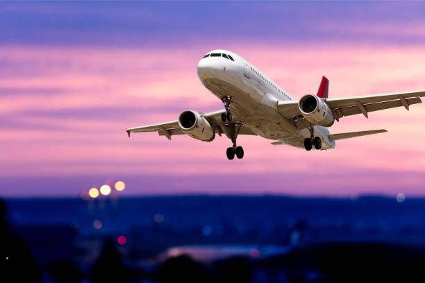 istock Passenger airplane is taking off at dusk 2122432687