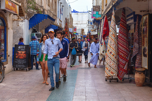 ESSAOUIRA, MOROCCO - JUNE 09, 2017: Unknown people walking on the old historic streets of the Essaouira.