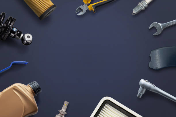 istock Car parts and tools neatly arranged on a clean surface with copy space in the middle. Concept of car repair and service 2122479982