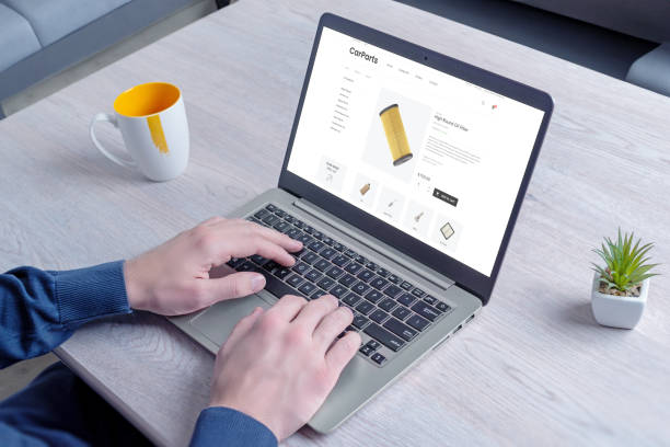 istock Finding car parts online on an e-commerce website on a laptop in the study. Illustrating convenience and accessibility of shopping automotive parts online 2122479985