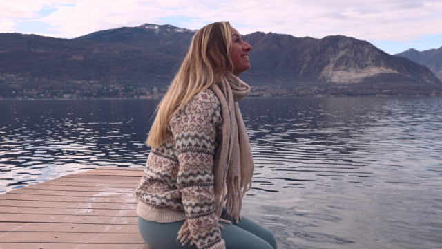 Slow motion: sitting by the lake and contemplating nature