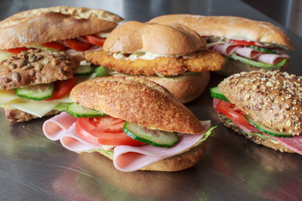 istock Various snacks, sandwiches with ham, salad, cheese and butter 2122524611