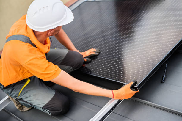 istock Workers building solar panel system on roof of house. Men installing photovoltaic solar module 2122526672