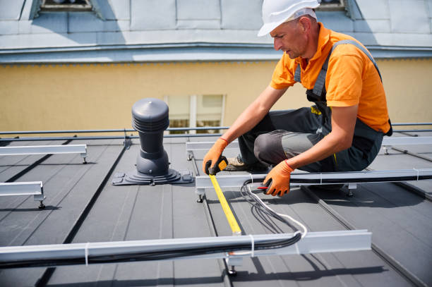 istock Worker building photovoltaic solar panel system, using ruler to measure mounting equipment. 2122526681