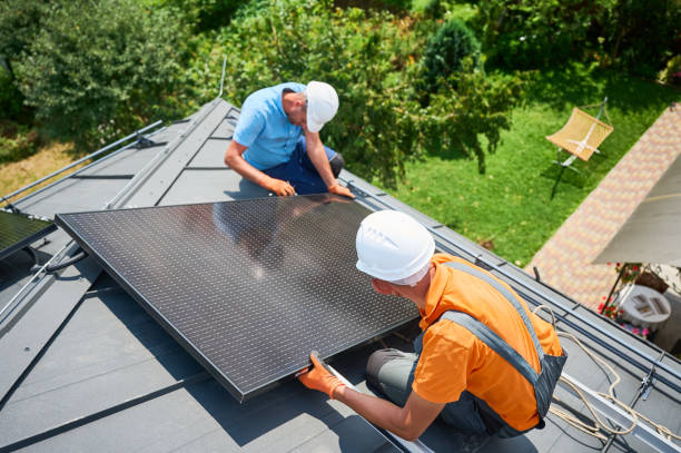 istock Workers building solar panel system on roof of house. Men installing photovoltaic solar module 2122526705