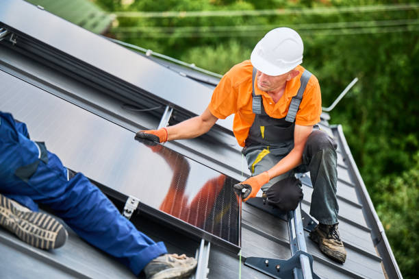 istock Workers building solar panel system on roof of house. Men installing photovoltaic solar module 2122526707