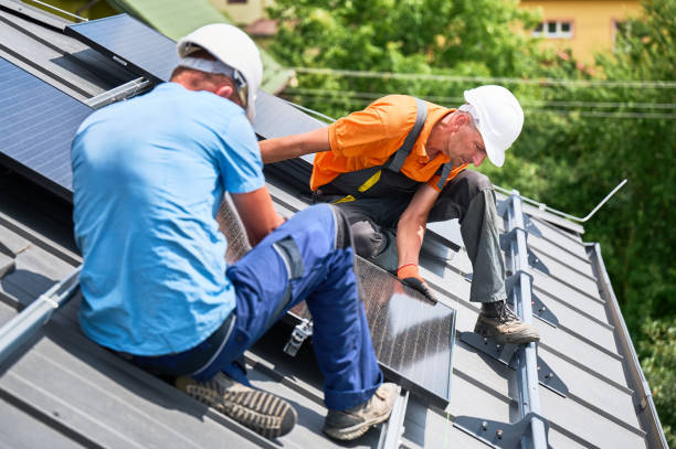 istock Workers building solar panel system on roof of house. Men installing photovoltaic solar module 2122526708
