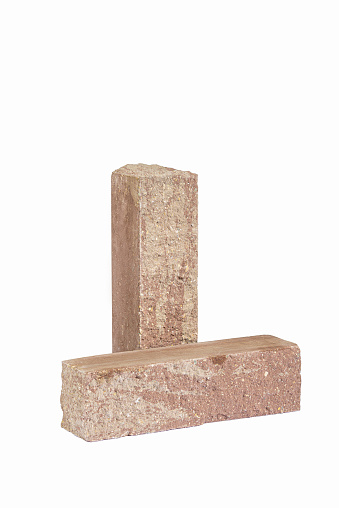 Pair of Solid Artificially Aged Elongated Washed Light Red Bricks for Building Construction Works Isolated on White.Vertical Composition