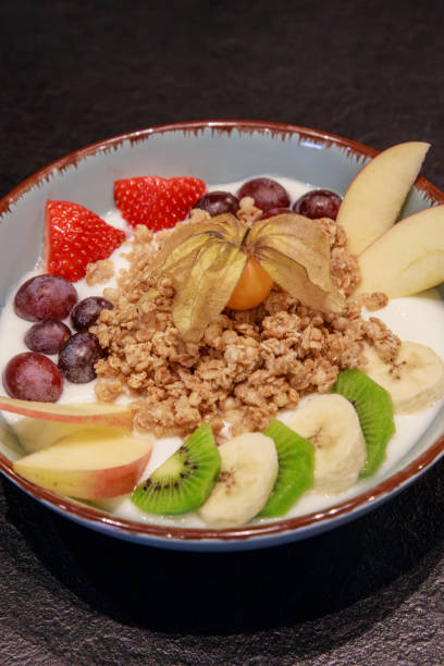 istock yogurt, muesli and fruit in a bowl 2122568121