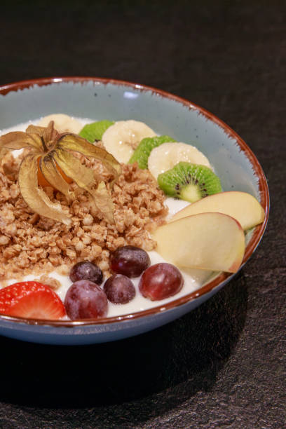istock yogurt, muesli and fruit in a bowl 2122568130