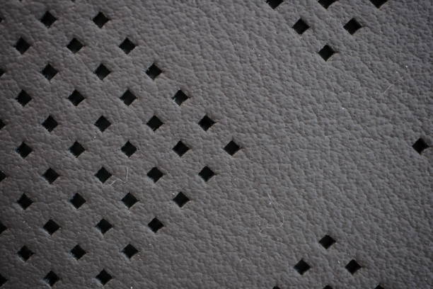 Car seat gray perforated natural leather texture extreme close-up