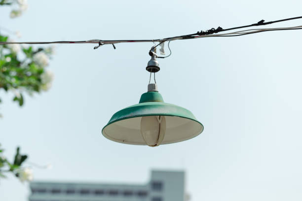 Green circular lamps in the shape of bowl in the park.
