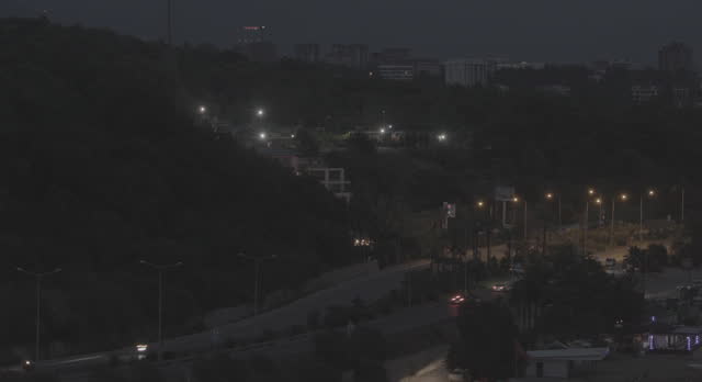 Incekum, Turkey. City Car Traffic. Day To Night Time-lapse. Urban Night City Life. Evening To Night Transition. Evening Time Lapse. Cityscape Skyline. Night Light Lighting Timelapse. Ungraded C-log 2