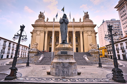 Tiradentes Palace. Front view with Tiradentes statue in front. Monumental century-old construction designed in Eclectic Style with pillars and decorative sculptures.