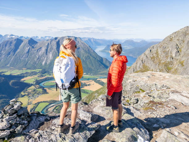 istock Two Hikers Standing On Top Of A Mountain 2122657092