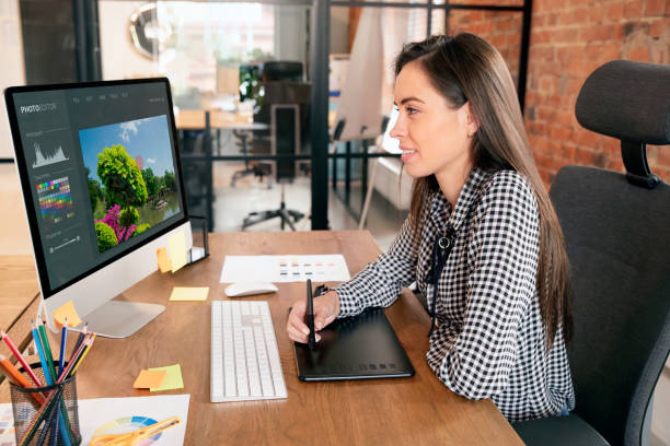 istock Graphic designer woman working in office 2122660853