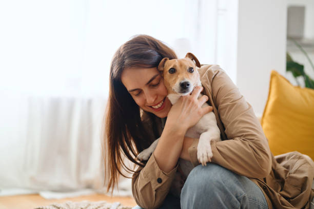 istock Pet sitter cuddling the pet 2122667429