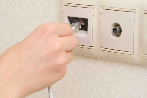 Electrical outlet on a white wall.